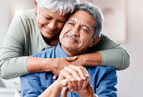 Aging Interventions - Caring for spouse - An older couple hugging